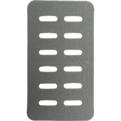 Rectangular, gray metallic object with seven parallel horizontal slots, evenly spaced, occupying the center. The surface appears textured. Lines of small text and symbols are faintly visible on the right side—resembling a Vertx Molle Adaptor Panel - Double.