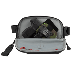 The Vertx Everyday Fanny Pack 2.0 by Vertx is a black zippered pouch with side straps, shown open to display a compact handgun in a holster and fabric items, making it perfect for off-body carry.