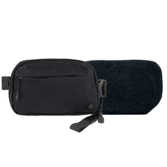 The Vertx/Premier Armored Vertx Everyday Fanny Pack 2.0 Bundle—a compact black pouch with front pocket and tags—rests before a textured pad, both displayed on a white background, highlighting its tactical everyday design.