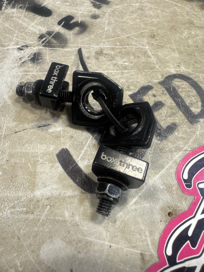 Box three chain tensioners