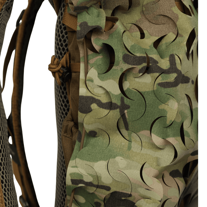 A close-up of the OPE Gear Backpack Scrim - Camouflage Pack Cover by OPE Gear, highlighting its camouflage pattern, Cordura nylon construction, laser-cut slits, mesh padding, and detailed stitching.