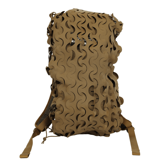 A Coyote Brown backpack is outfitted with the OPE Gear Backpack Scrim - Camouflage Pack Cover by OPE Gear, made of Cordura nylon with an abstract wavy pattern. The straps show through, and the bag is set against a white background.