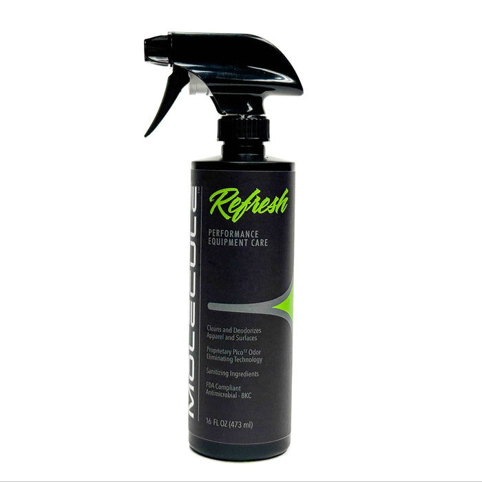 A 16 oz (473 mL) black spray bottle of Molecule Refresh Sprayer, featuring green and white text on the label, is upright against a white background. Designed for cleaning and deodorizing equipment and surfaces, this product serves as an effective gear odor eliminator and deodorizer for technical fabrics.