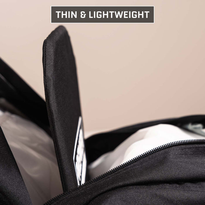 A close-up of a 5.11 Rush 24/72 Pack with an open zipper reveals a Premier Body Armor Level IIIA Insert being placed inside. Text at the top reads “THIN & LIGHTWEIGHT.” This insert meets NIJ ballistic standards for protection.