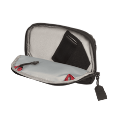 The Vertx Everyday Fanny Pack 2.1 is a compact EDC waist pack with a light gray interior, black zipper with red accent, and ballistic-panel compatibility. Shown open with a black fabric item stored inside.